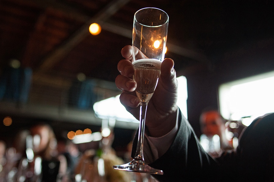 cheers with champagne, a detail moment during the speeches at a wedding at a vineyard in CT
