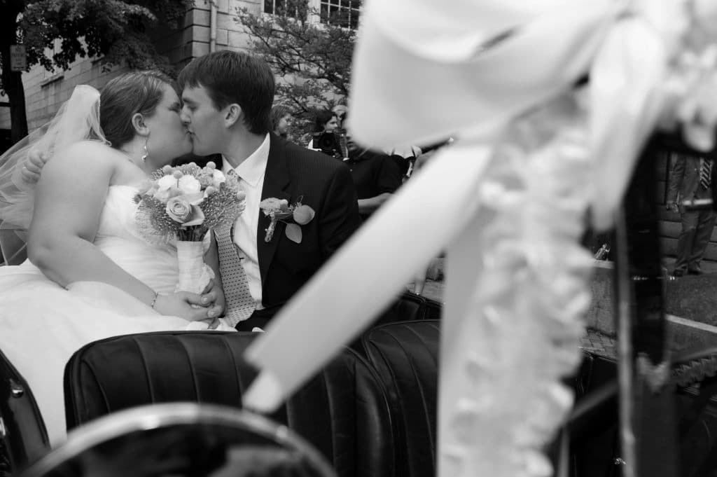 the moment right after the ceremony at the Art Club in Providence RI as the bride and groom get into their get away car